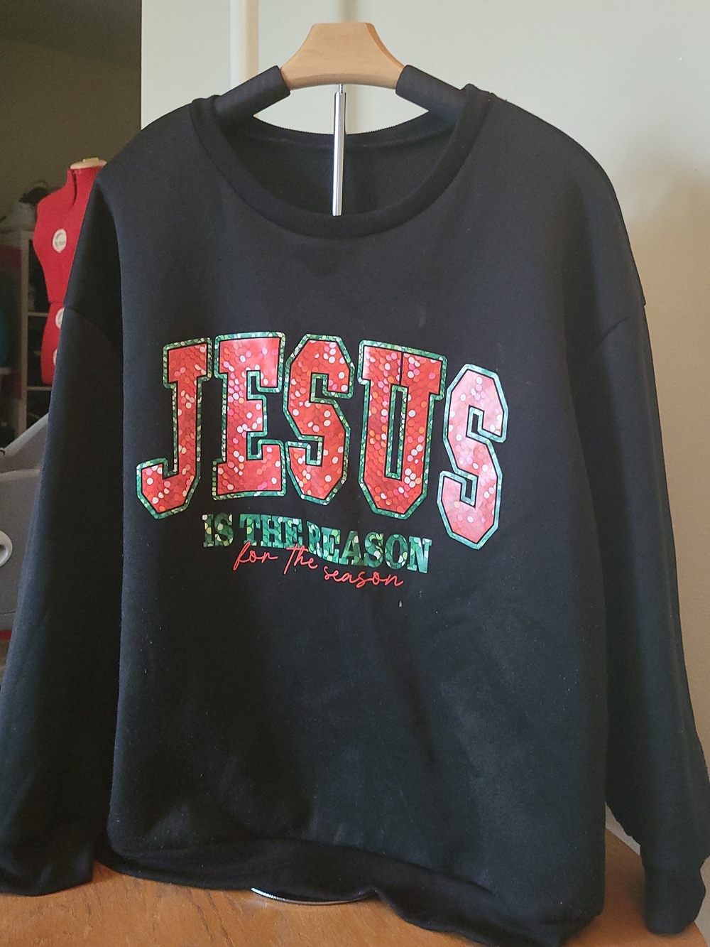 Black Holiday Sweatshirt with 'JESUS' Graphic